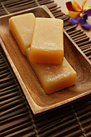 Natural soap on wooden bowl. - Nugene Chiang