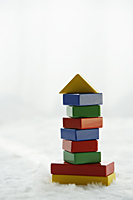 stack of colourful building blocks - Alex Mares-Manton