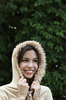 head shot of smiling young woman wearing hooded jacket. - Alex Mares-Manton