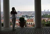 rear view of woman taking a photo of Prague - Alex Hajdu