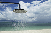 close up of outdoor shower with clouds and blue sky as background - Alex Mares-Manton
