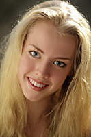 Head shot of smiling young, blonde woman - Alex Mares-Manton