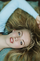Head shot of young blonde woman laying down - Alex Mares-Manton