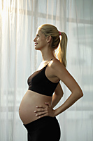 profile of pregnant woman looking up - Alex Mares-Manton