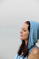 profile of young woman wearing hooded sweatshirt - Alex Mares-Manton