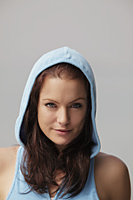 Head shot of young woman wearing blue hoodie - Alex Mares-Manton