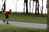 young man skating through park - Alex Mares-Manton